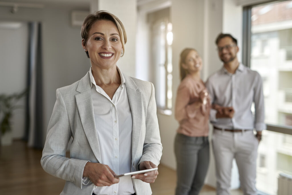 Portrait of happy female luxury estate staff